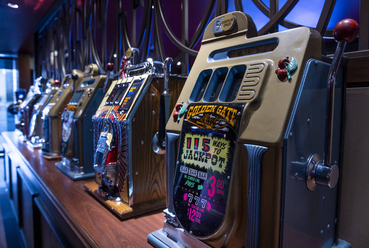 Vintage slot machines line the entrance as the Golden Gate is celebrating its 116th year of ope ...