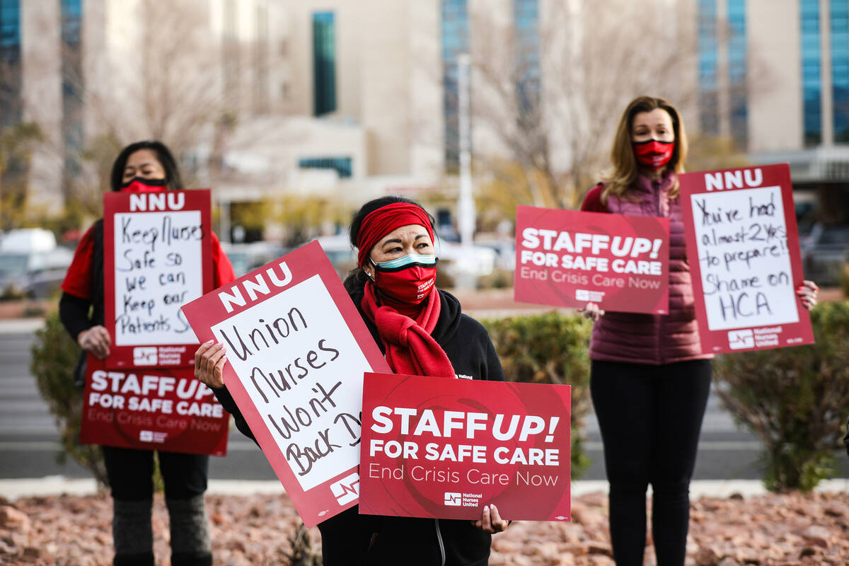 Diana Armstrong, center, a registered nurse at MountainView Hospital, joins her colleagues in p ...