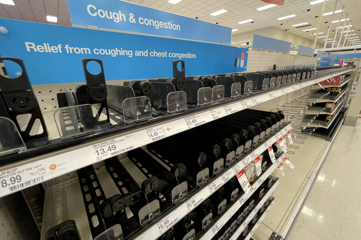 Empty cold and cough medicine shelves are seen at Target, 3210 N Tenaya Way, in Las Vegas, Thur ...