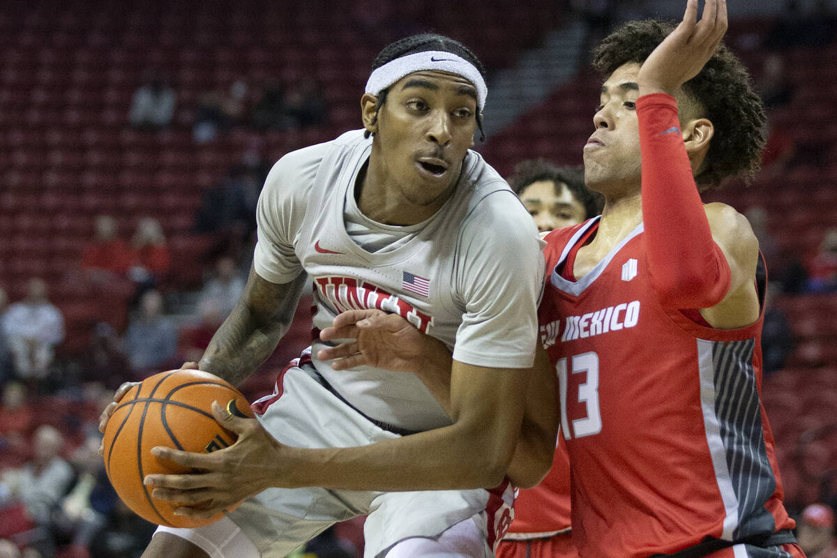 UNLV Rebels forward Donovan Williams (3) shoots against New Mexico Lobos guard Javonte Johnson ...