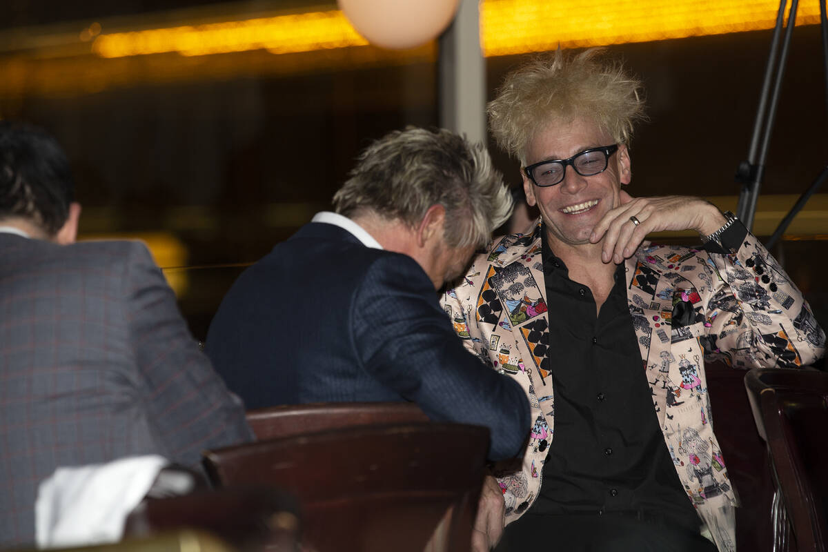 Magician Murray SawChuck laughs with Zowie Bowie during a roast of former Las Vegas mayor Oscar ...