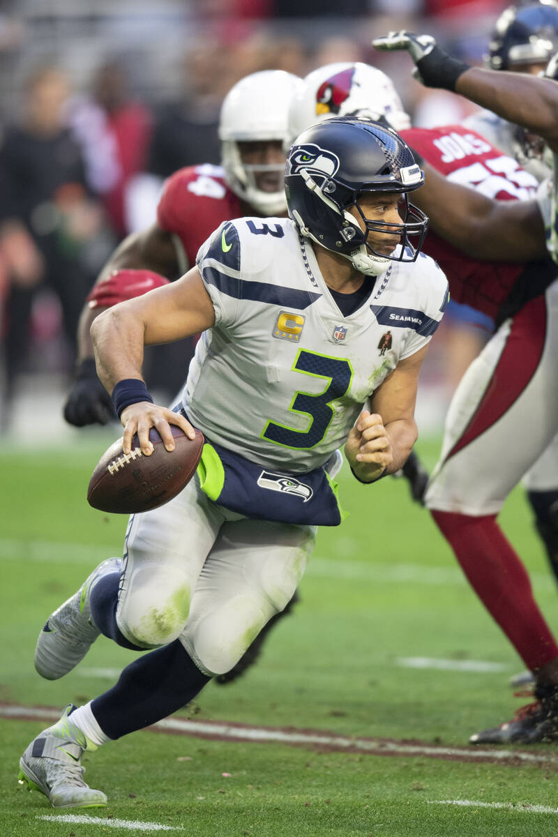 Seattle Seahawks quarterback Russell Wilson (3) scrambles against the Arizona Cardinals during ...