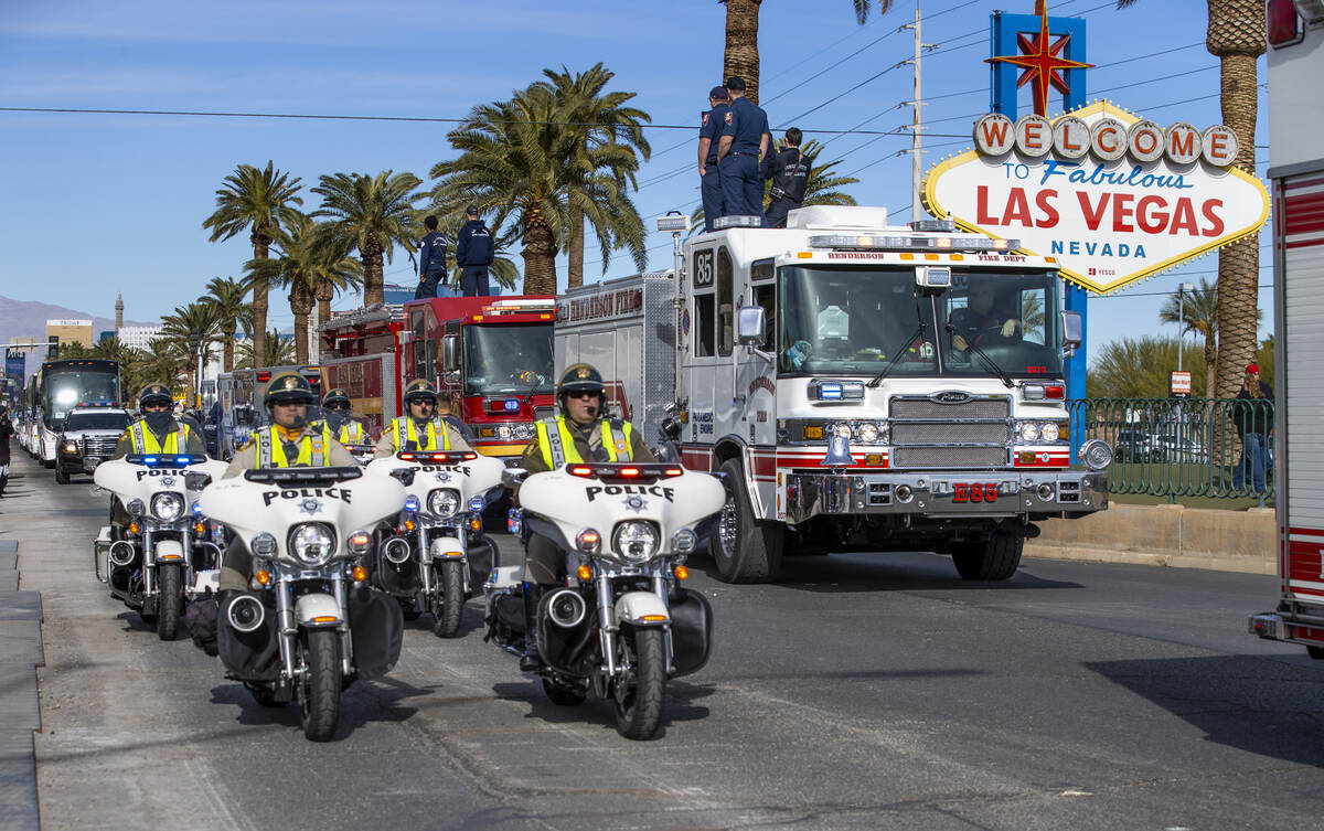 Busses with Raiders players, coaches and personnel are escorted by Metro to depart the city as ...