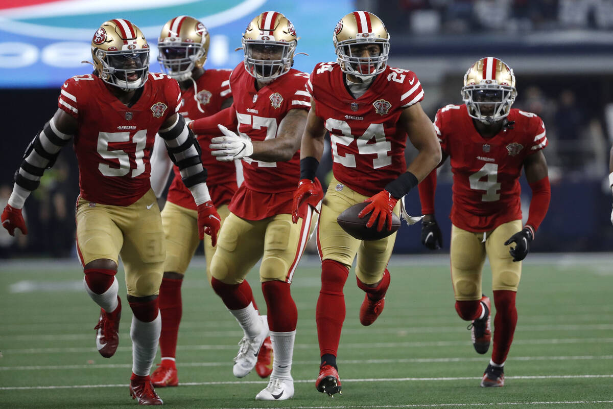 San Francisco 49ers defensive back K'Waun Williams (24) celebrates with teammates after interce ...