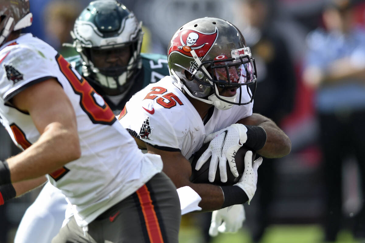 Tampa Bay Buccaneers running back Giovani Bernard (25) runs 2-yards for a score against the Phi ...