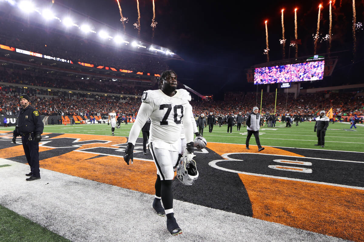 Raiders guard Alex Leatherwood (70) walks off the field after his team’s loss against th ...