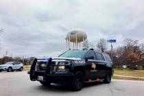 A Texas state trooper blocks traffic on a road leading to a Colleyville, Texas, synagogue where ...