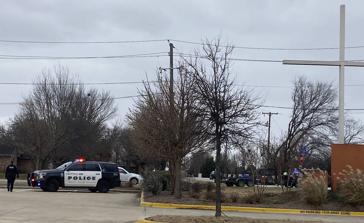 Colleyville police secure the area around Congregation Beth Israel synagogue on Saturday, Jan. ...
