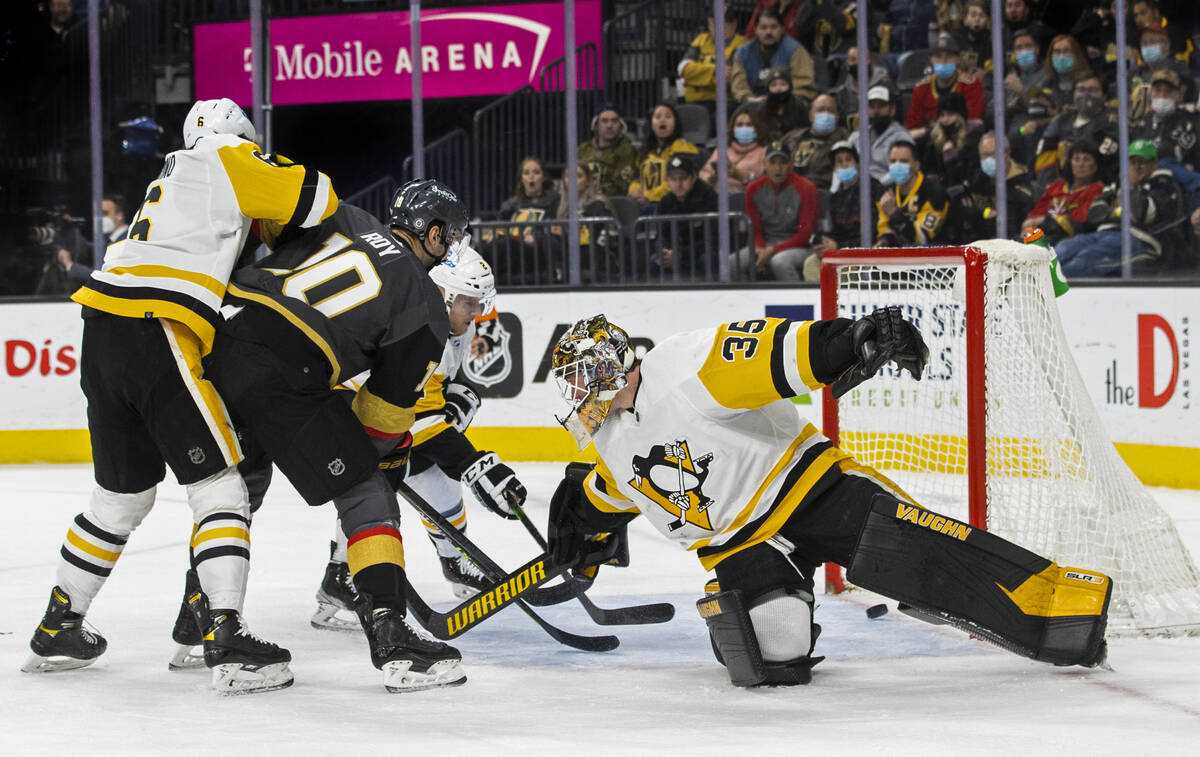 Golden Knights center Nicolas Roy (10) scores against Pittsburgh Penguins goaltender Tristan Ja ...