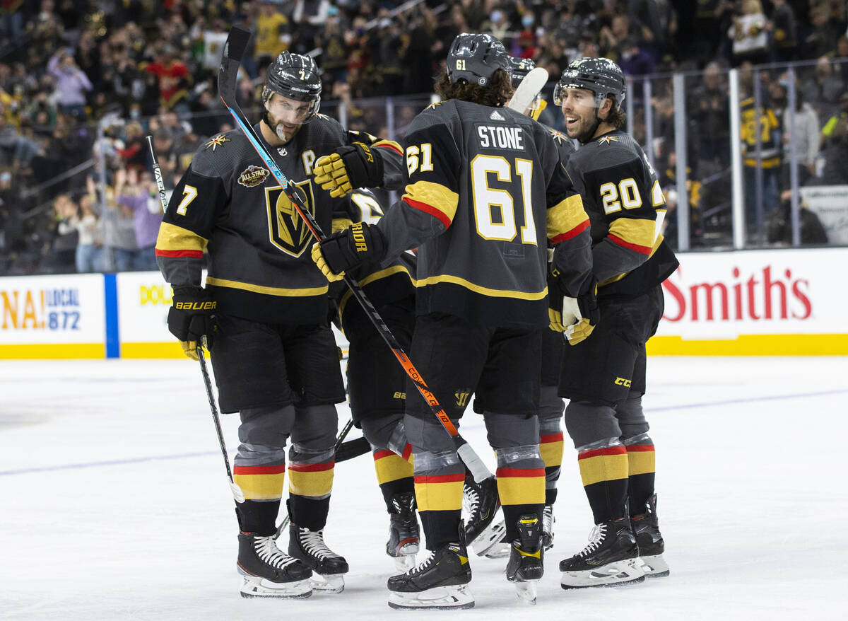 The Golden Knights celebrate a first period goal by right wing Evgenii Dadonov (63) during an N ...