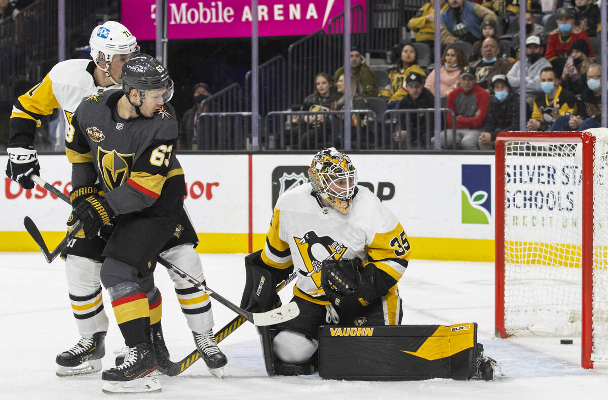 Golden Knights right wing Evgenii Dadonov (63) scores against Pittsburgh Penguins goaltender Tr ...