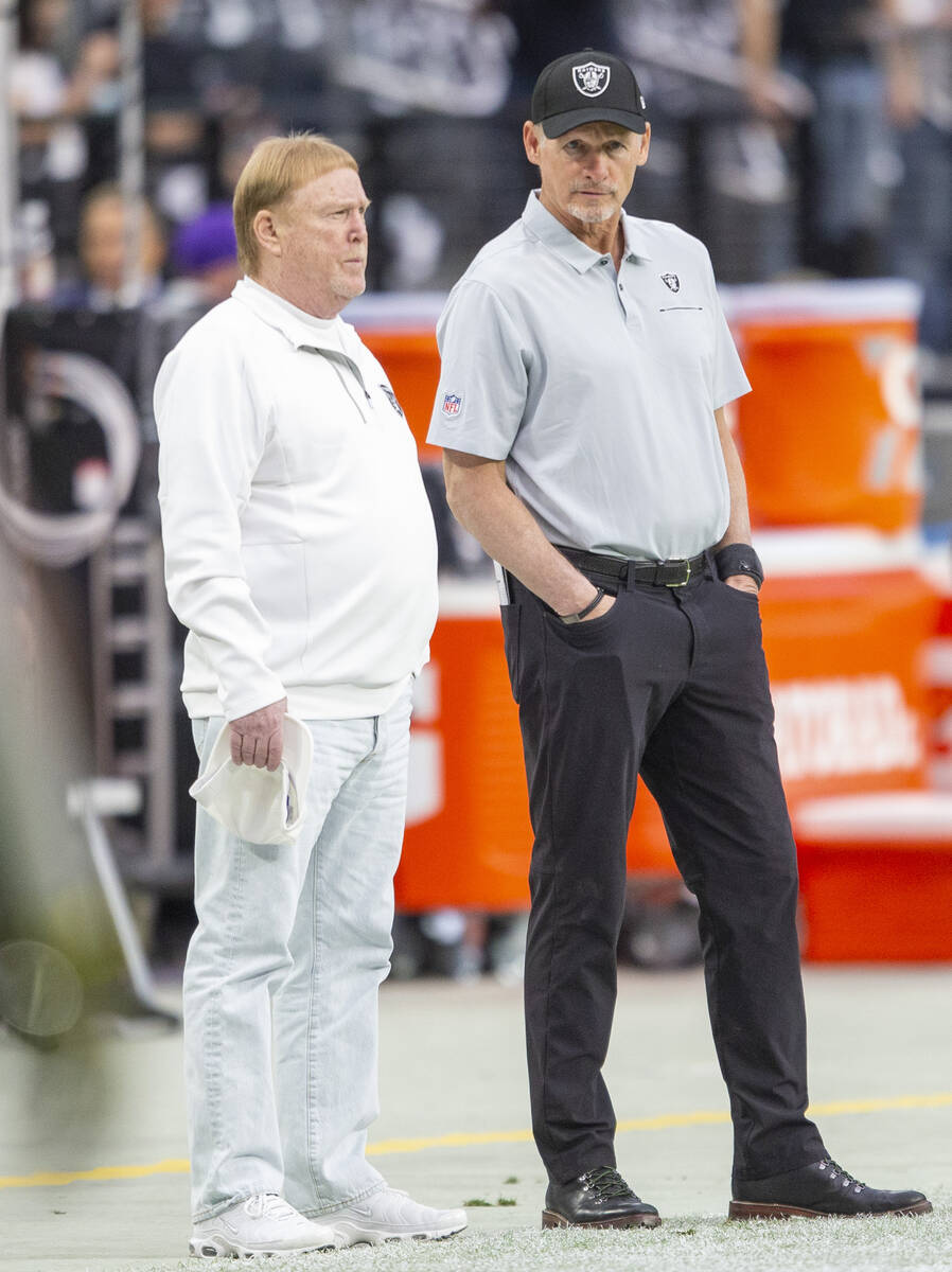 Las Vegas Raiders owner Mark Davis, left, and general manager Mike Mayock look on from the side ...