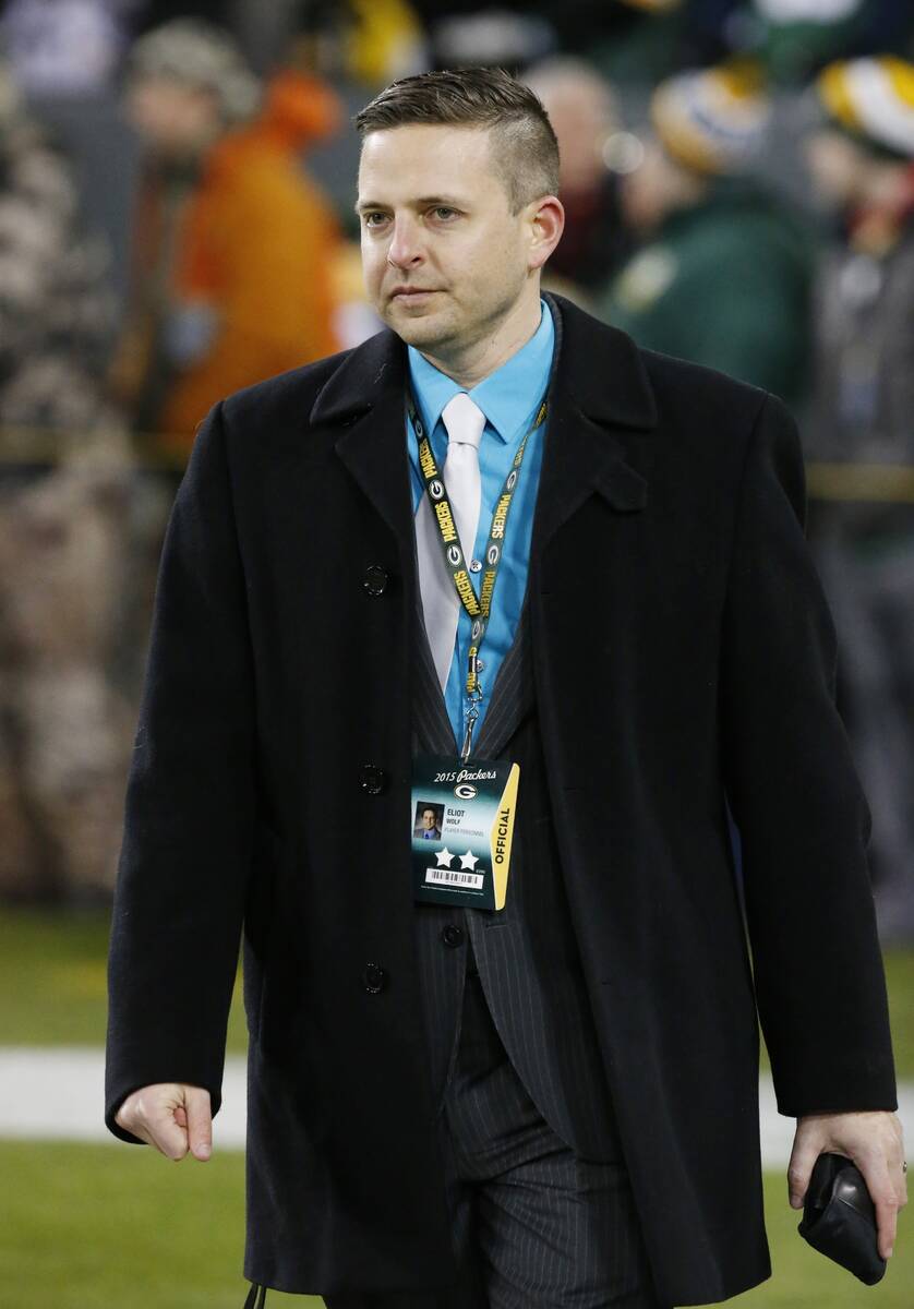 Green Bay Packers Eliot Wolf walks on the field before an NFL football game against the Minneso ...