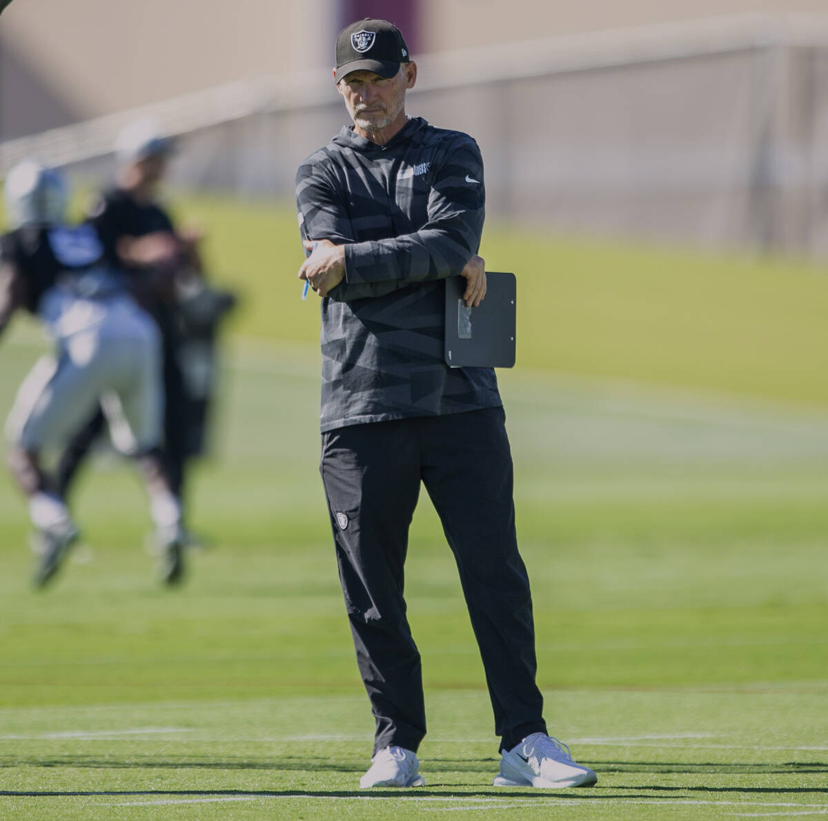 Raiders general manager Mike Mayock looks on during a practice session at the Raiders Headquart ...