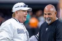 Raiders owner Mark Davis chats with interim head coach Rich Bisaccia on the field before the fi ...