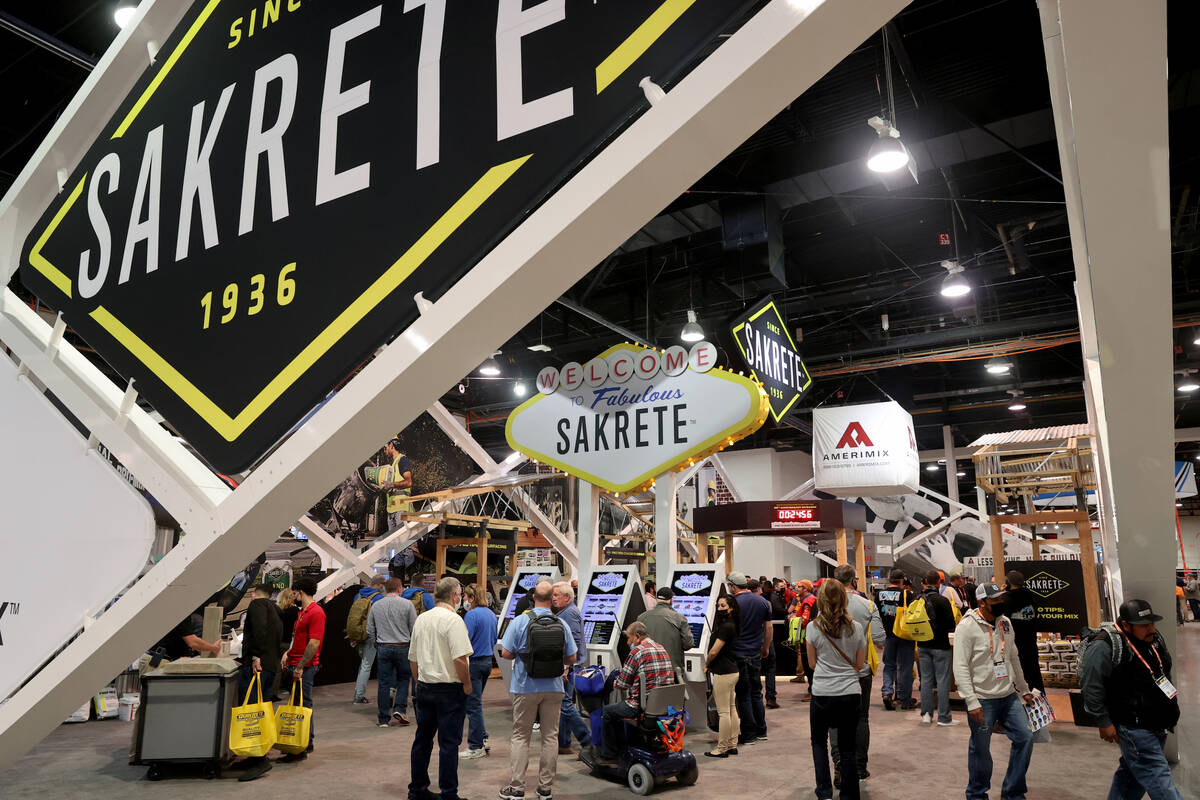 Conventioneers in the Sakrete booth at the World of Concrete construction trade show at Las Veg ...