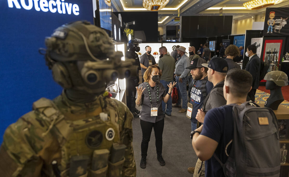 Morgana Gordon, with Busch Protective, speaks with attendees during the SHOT Show shooting, hun ...