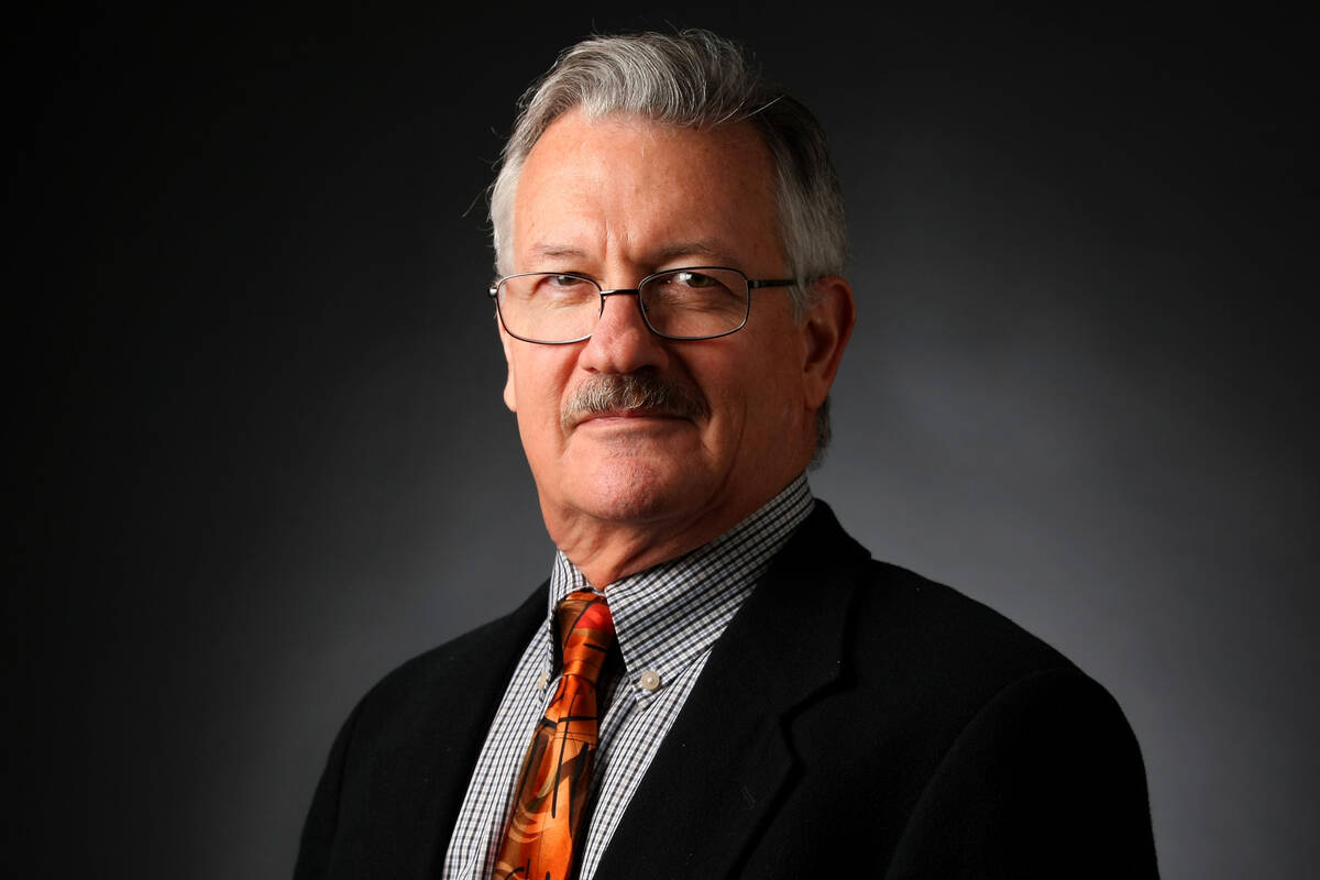 Mike Brunker, assistant city editor, poses for a portrait at the Las Vegas Review-Journal photo ...