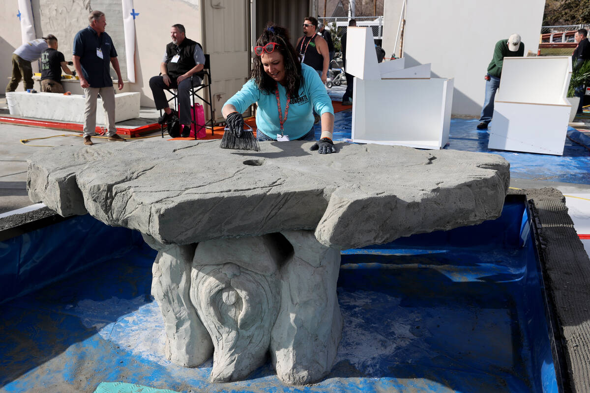 Artist Rebecca Fuscardo of Weirton, W.Va. works on her concrete water fountain in the Concrete ...