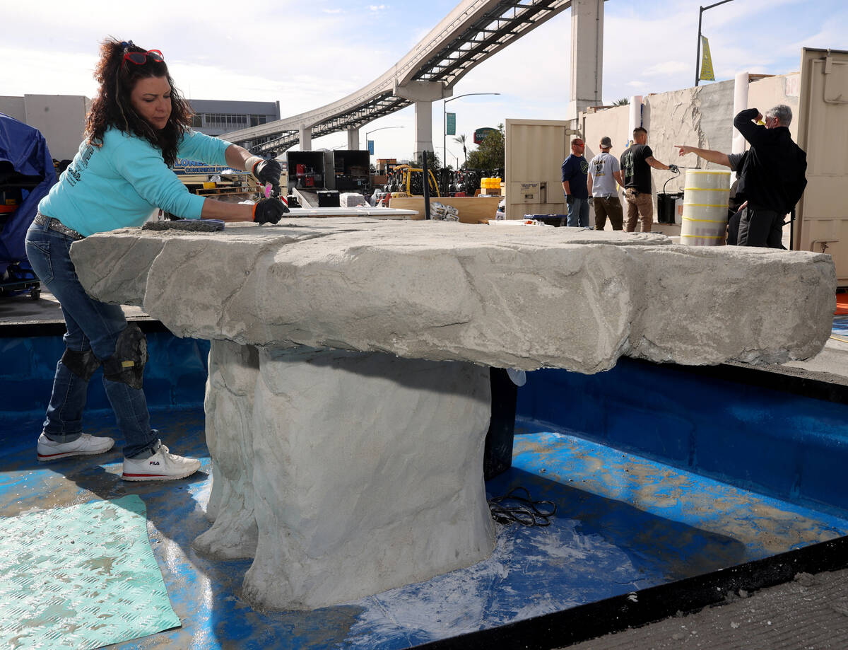 Artist Rebecca Fuscardo of Weirton, W.Va. works on her concrete water fountain in the Concrete ...