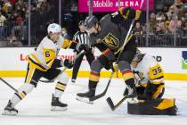 Golden Knights center Nicolas Roy (10) leaps to try and redirect a shot past Pittsburgh Penguin ...