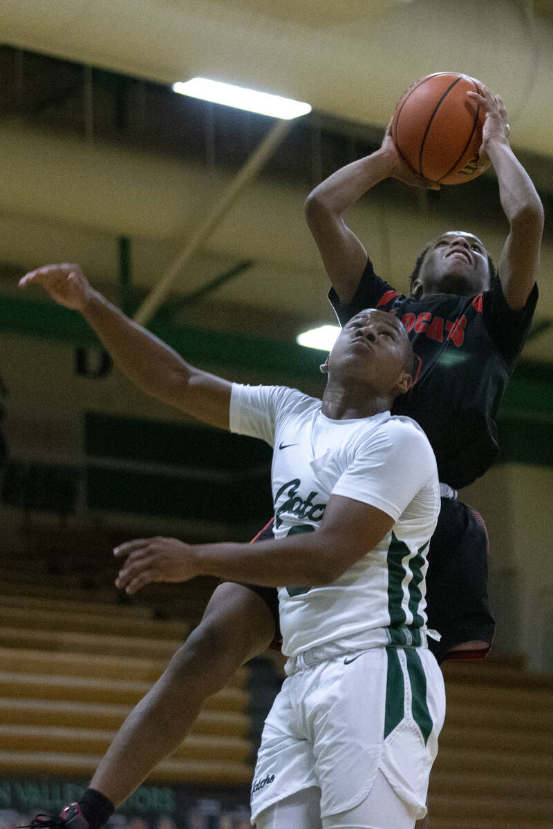 Las Vegas’ Tayshaun Jackson (3) shoots against Green Valley’s Dominic Washington ...