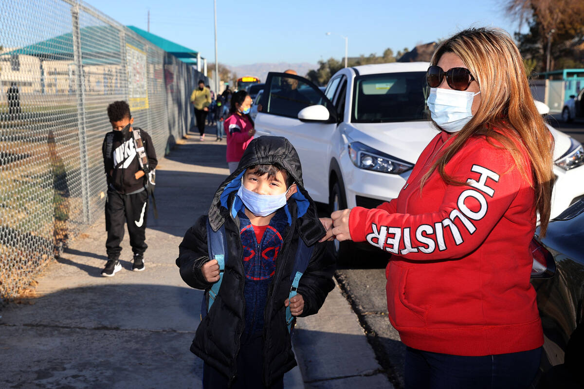 Maria Vega drops her son Aaron, 6, off at Rowe Elementary School in Las Vegas Wednesday, Jan. 1 ...