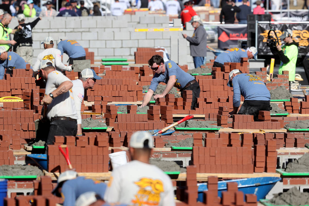 Masons compete in the Bricklayer 500 during the World of Concrete construction trade show at th ...