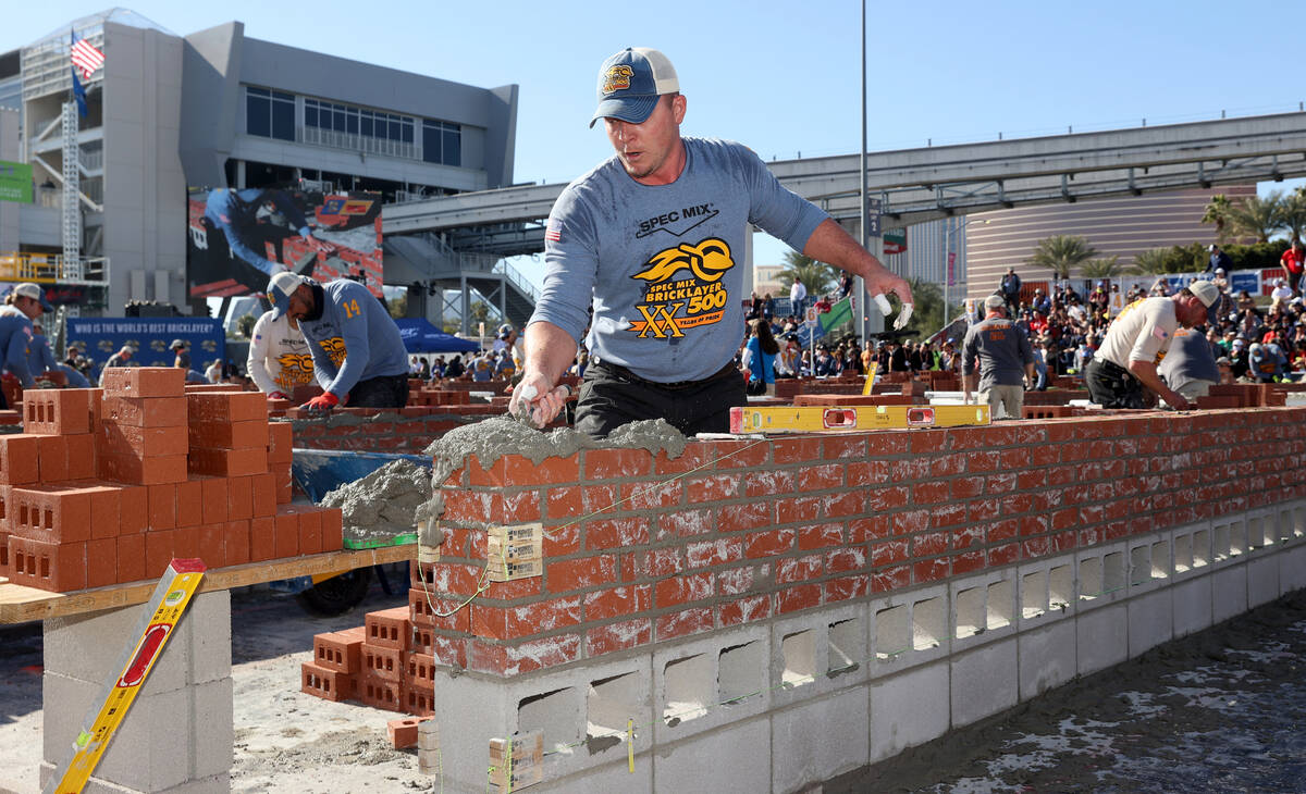 Masons, including JT Payne (13) of Foeste Masonry of Cape Girardeau, Mo., compete in the Brickl ...