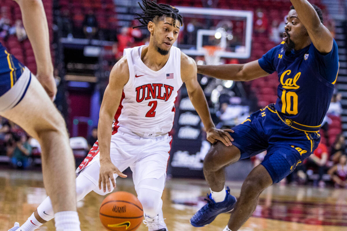 UNLV Rebels guard Justin Webster (2) looks to drive the lane past California Golden Bears guard ...