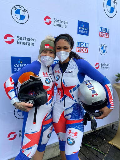 Former UNLV track athlete poses with U.S. bobsled teammate Kaillie Humphries after they won the ...