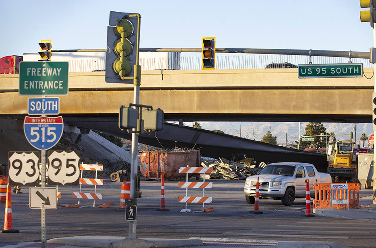 A pile of debris is left after a portion of a bridge on U.S. 95 over North Eastern Avenue colla ...