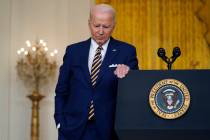 President Joe Biden listens to a question during a news conference in the East Room of the Whit ...