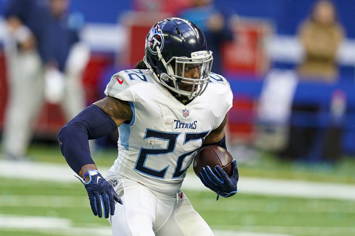 Tennessee Titans running back Derrick Henry runs against the Indianapolis Colts in an NFL footb ...