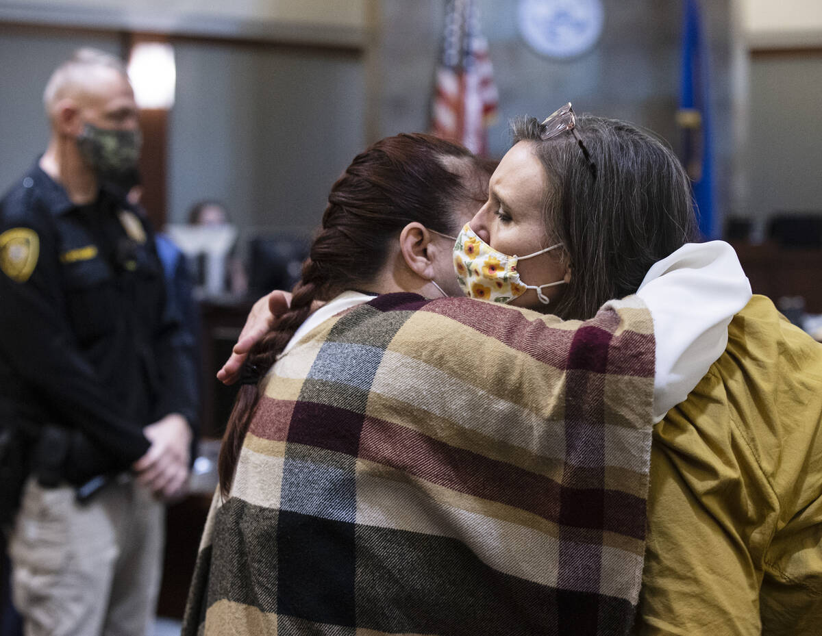 Barbara Short, left, the mother of shooting victim Bailley Short, hugs her sister Leslie Murrel ...