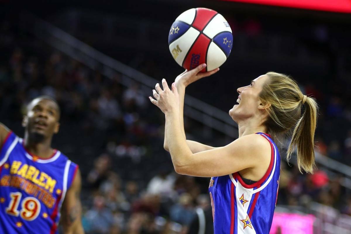KSNV-TV reporter Amber Dixon shoots as the Harlem Globetrotters perform at T-Mobile Arena in La ...