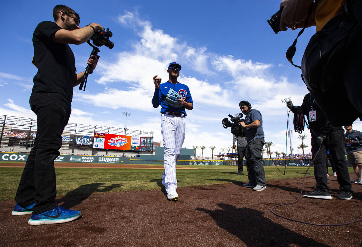 Chicago Cubs' Kris Bryant heads to the dugout before the start of a baseball game against the C ...