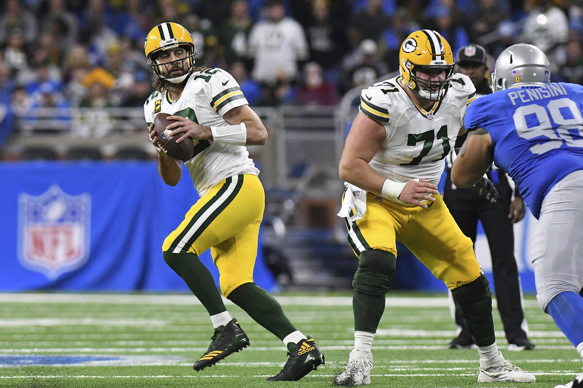 Green Bay Packers quarterback Aaron Rodgers looks downfield during the first half of an NFL foo ...