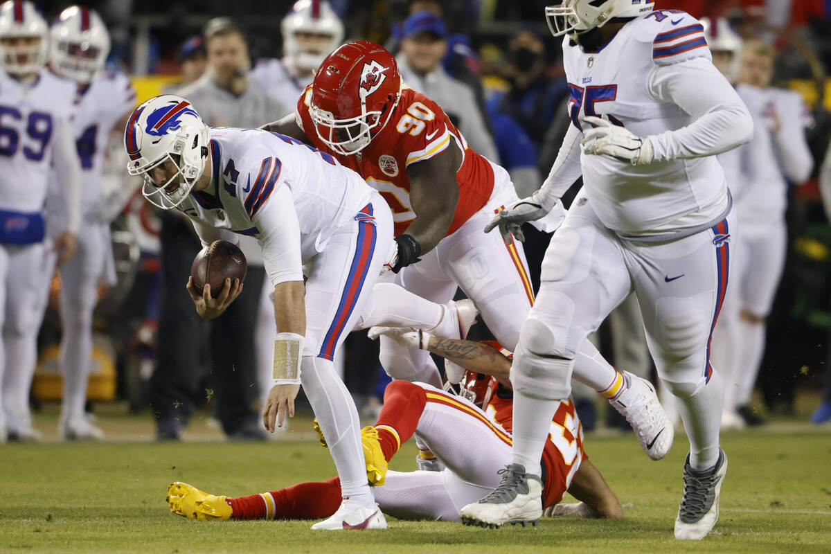 Buffalo Bills quarterback Josh Allen (17) is tackled by Kansas City Chiefs defensive tackle Jar ...