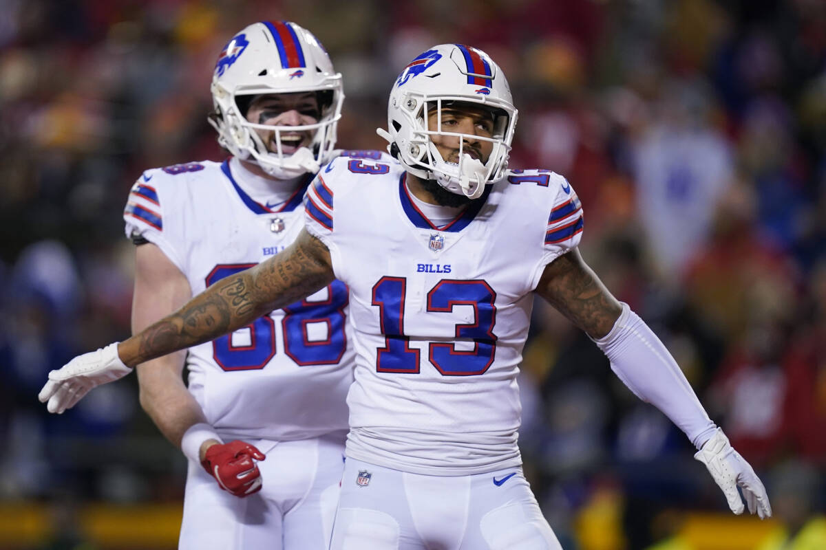 Buffalo Bills wide receiver Gabriel Davis (13) celebrates with teammate Dawson Knox (88) after ...