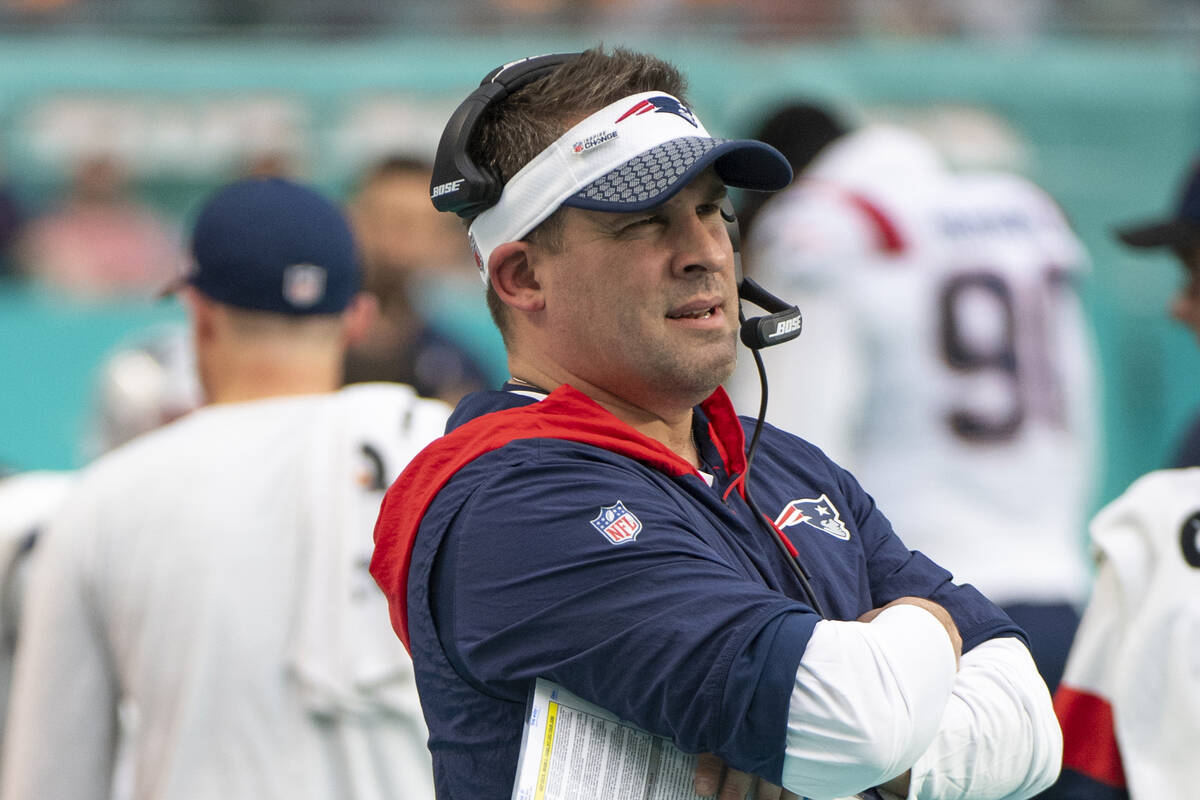 New England Patriots offensive coordinator and quarterbacks coach Josh McDaniels watches from t ...