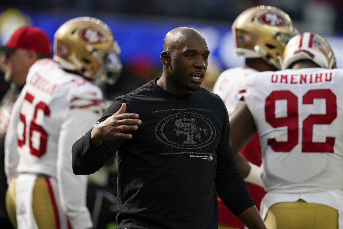 San Francisco 49ers defensive coordinator DeMeco Ryans greets a player before the team's NFL ga ...