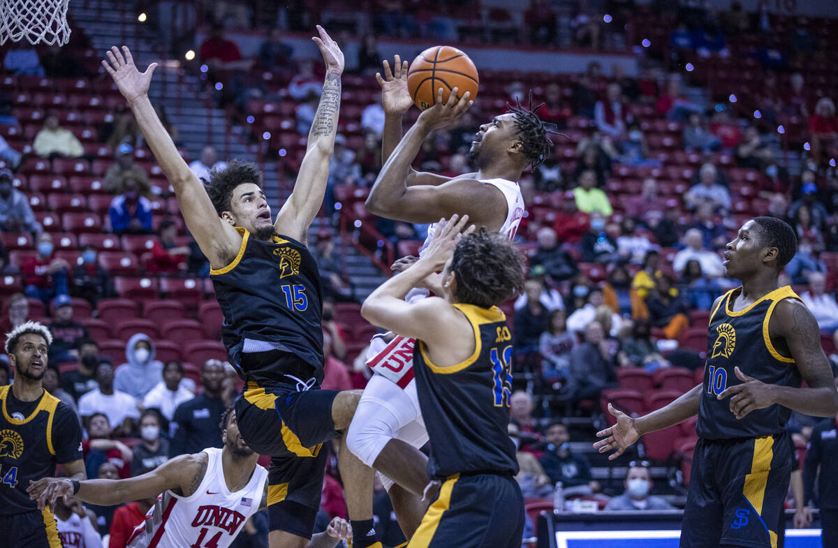 UNLV Rebels guard Bryce Hamilton (13) elevates for a shot over San Jose State Spartans forward ...