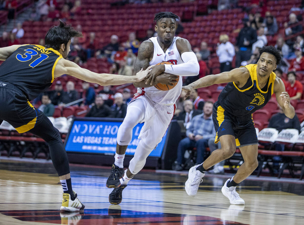 UNLV Rebels guard Michael Nuga (1) drives through the defense of San Jose State Spartans forwar ...