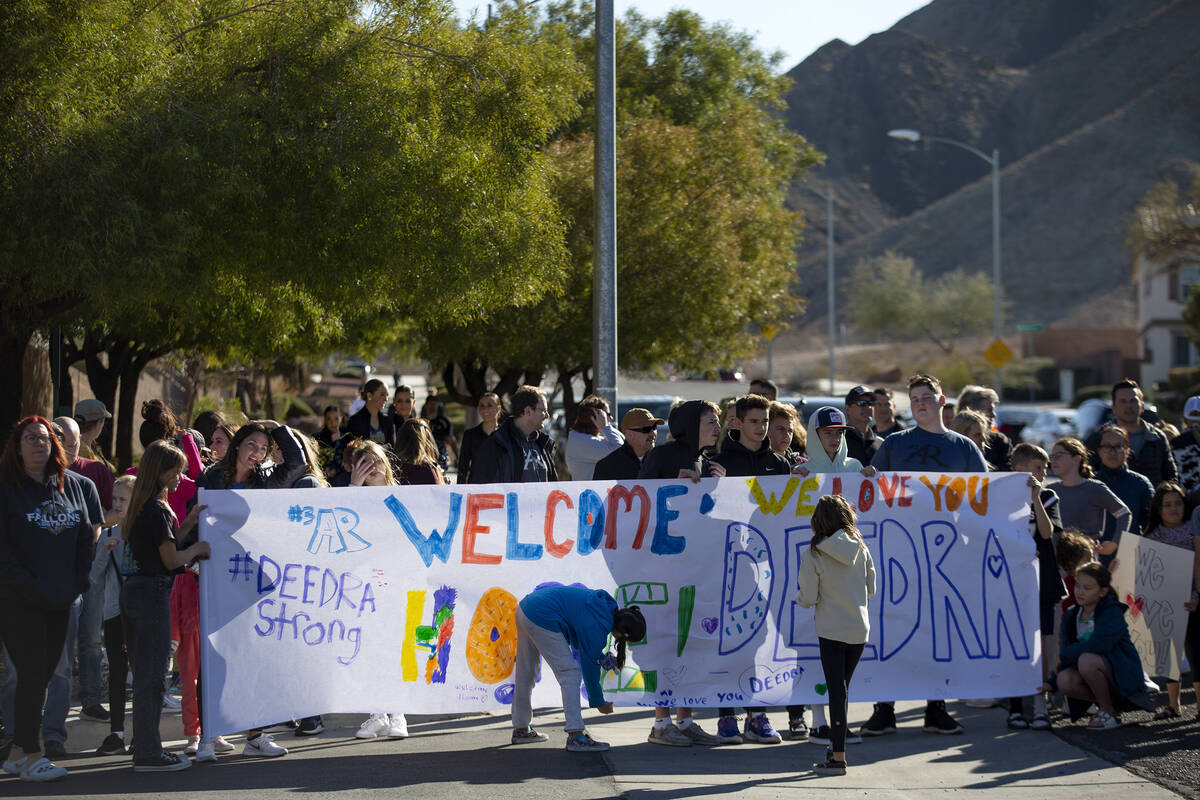 A group gathers to welcome Deedra Russell, who is returning home with her family after 136 nigh ...