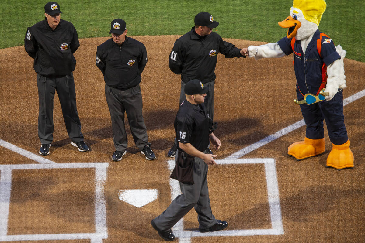 Umpires meet at home plate and are greeted by Spruce before the start of the Las Vegas Aviators ...