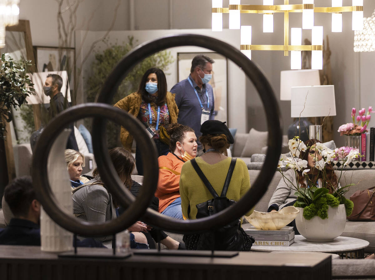 Shoppers browse at Alder & Tweed Furniture during the Las Vegas Market at World Market Cent ...