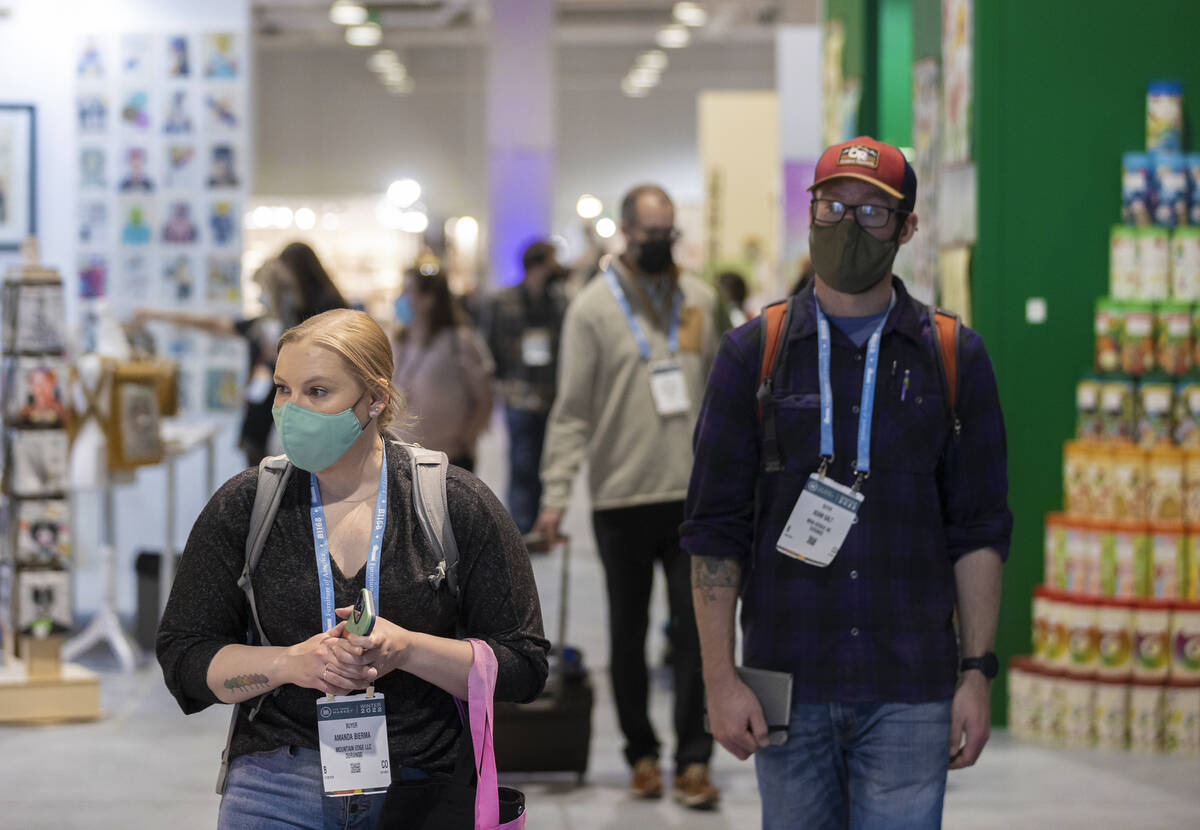 Amanda Bierma, left, with Mountain Edge LLC, walks the event halls during the Las Vegas Market ...