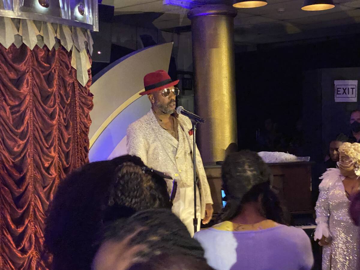 Eric Jordan Young is shown performing at "Backstory Pass," Usher's pre-show immersive productio ...