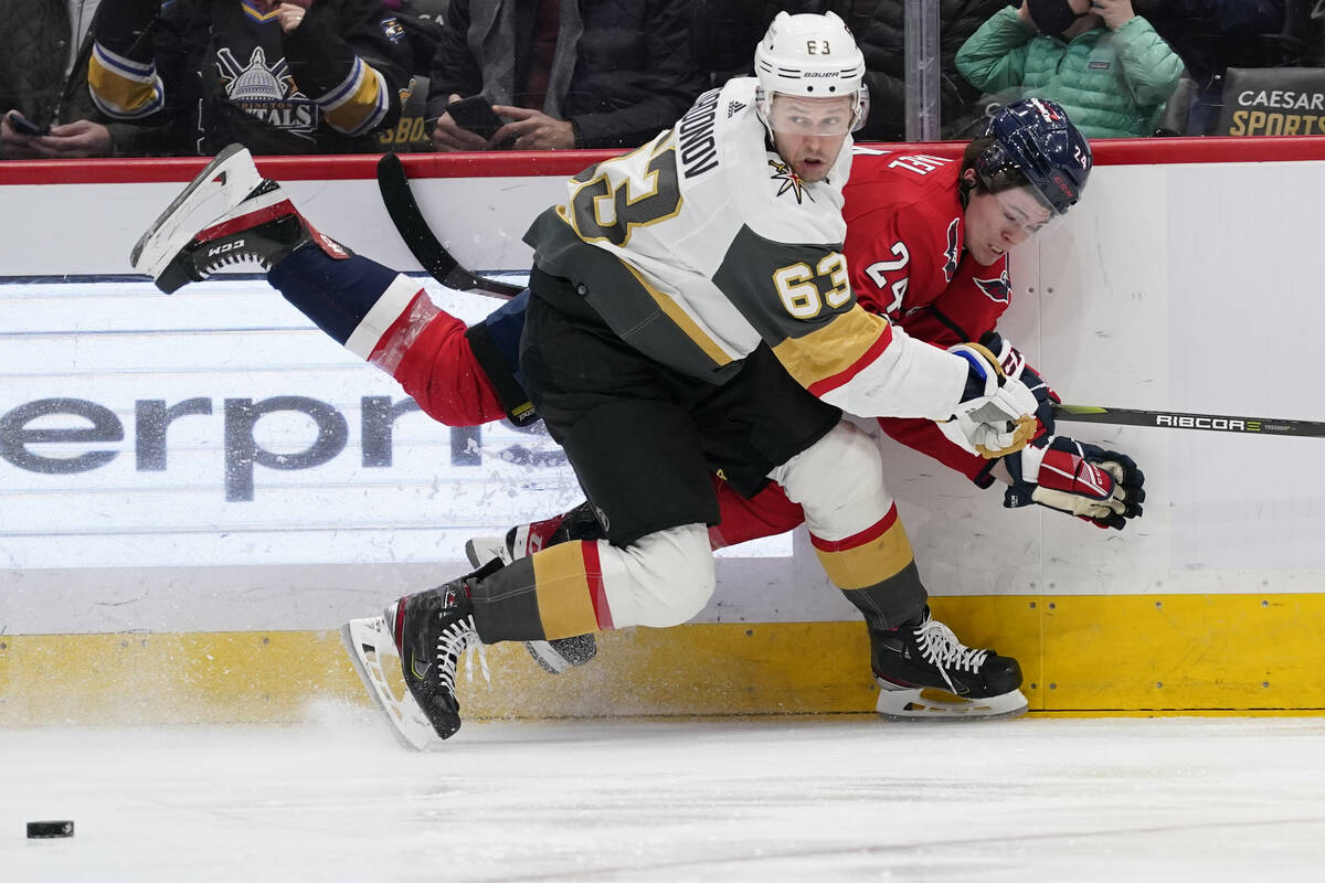 Vegas Golden Knights right wing Evgenii Dadonov (63) takes the puck away from Washington Capita ...